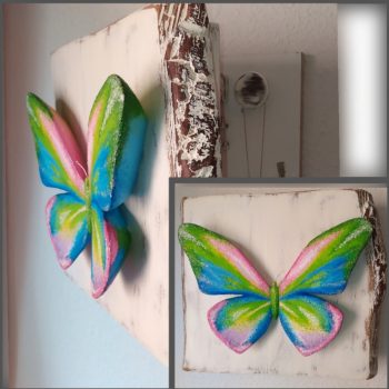 Mariposa tallada y pintada con óleo